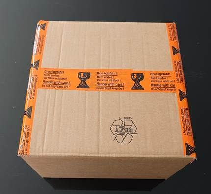 A box with tape on it AI-generated content may be incorrect.